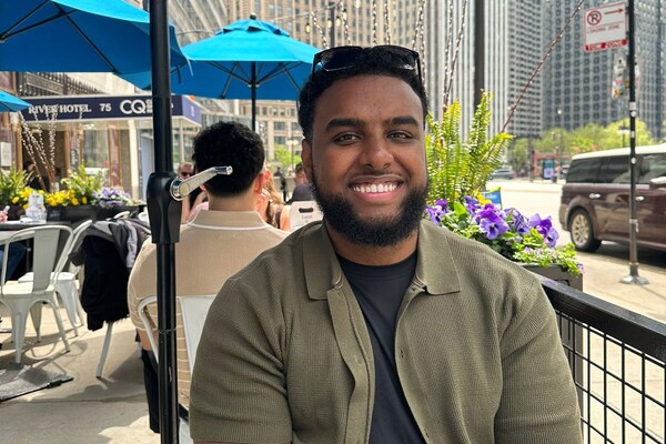 Dr. Bilal Negash on a patio, smiling