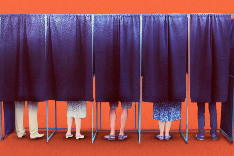 People hidden behind curtains in voting booths