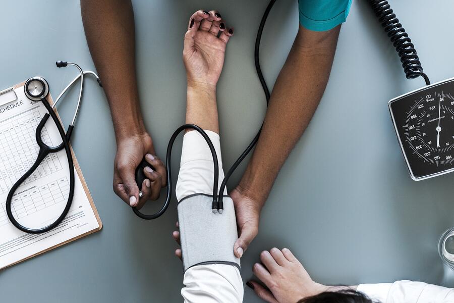 Woman taking blood pressure