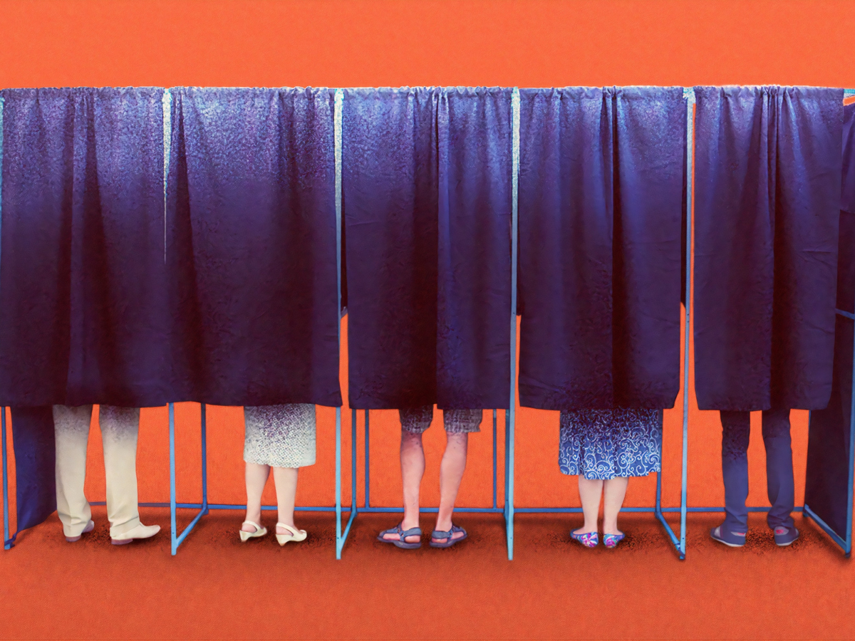 People hidden behind curtains in voting booths