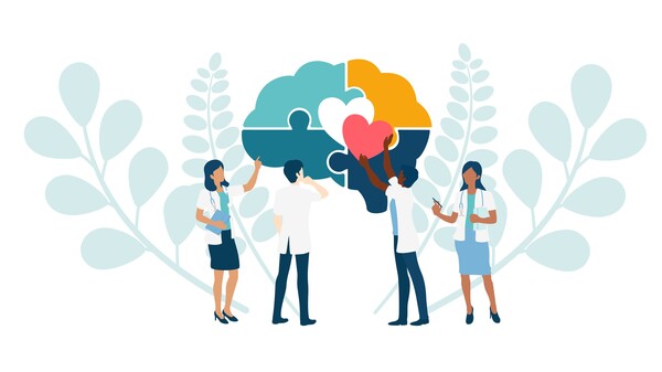 Four animated individuals placing a heart in the centre of a brain-shaped puzzle