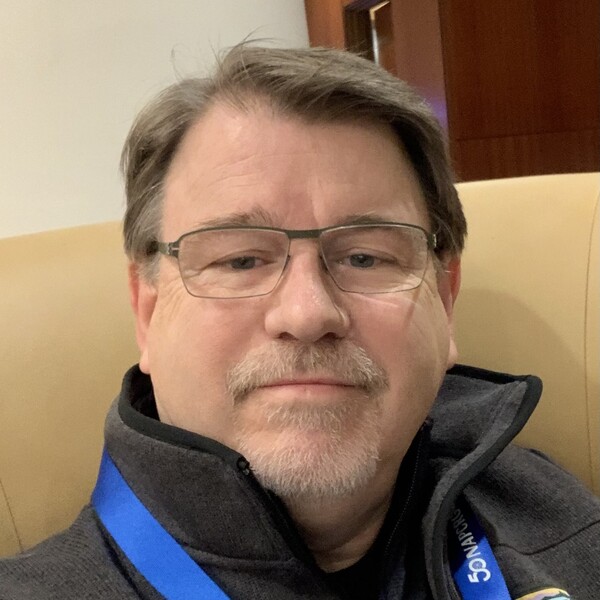 picture of man in glasses looking at camera