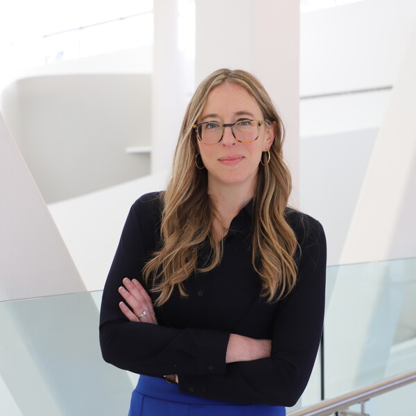 woman with arms folded looking into the camera