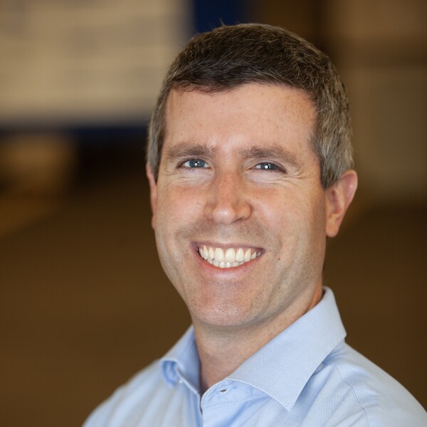 man looking at camera and smiling
